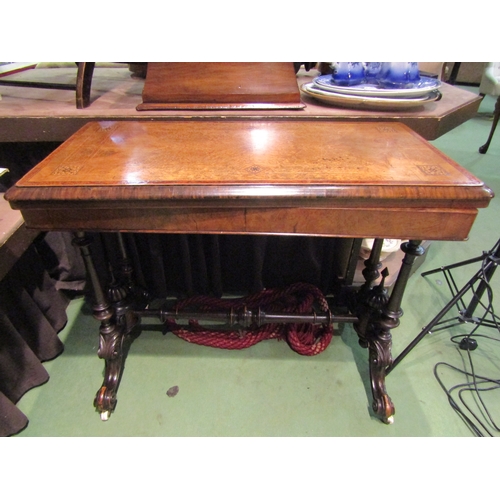 4003 - A circa 1850 burr walnut and inlaid hinged fold-over top card table on turned columns and carved leg... 