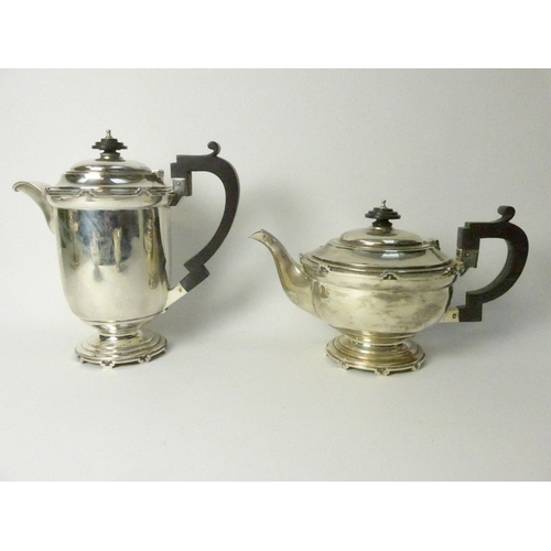 8001 - A Walker & Hall silver five piece castellated silver tea set, four pieces Sheffield 1934 and comport... 