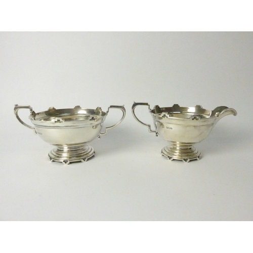 8001 - A Walker & Hall silver five piece castellated silver tea set, four pieces Sheffield 1934 and comport... 