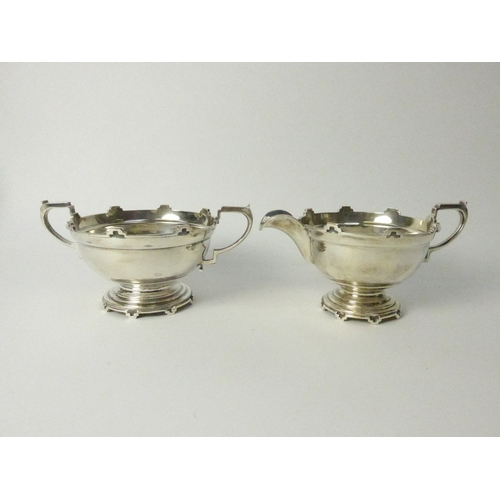 8001 - A Walker & Hall silver five piece castellated silver tea set, four pieces Sheffield 1934 and comport... 