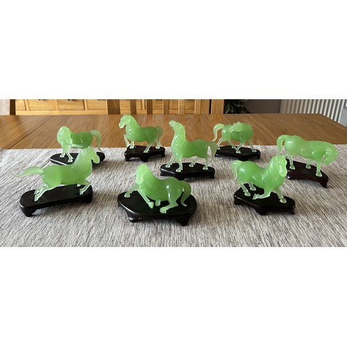 4365 - A collection of eight jade horses with wooden stands, two a/f, boxed