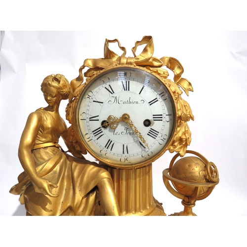 8048 - An early 19th Century French gilt metal mantel clock depicting Urania, white enamel Roman numeral di... 