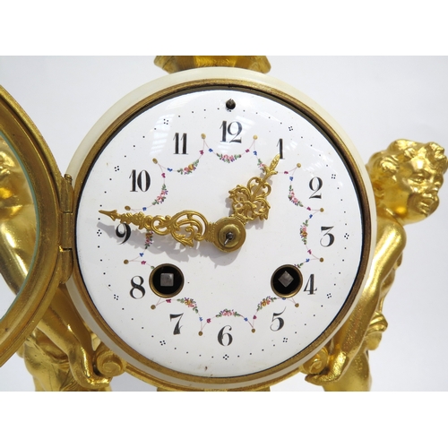 8057 - A 19th Century Louis XVI style white marble and ormolu/gilt metal mantel clock, the marble surrounde... 