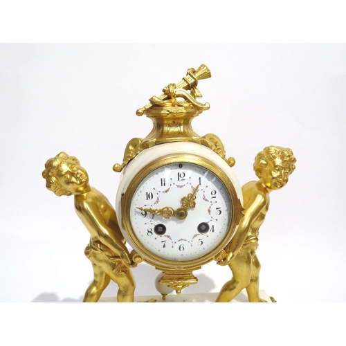 8057 - A 19th Century Louis XVI style white marble and ormolu/gilt metal mantel clock, the marble surrounde... 