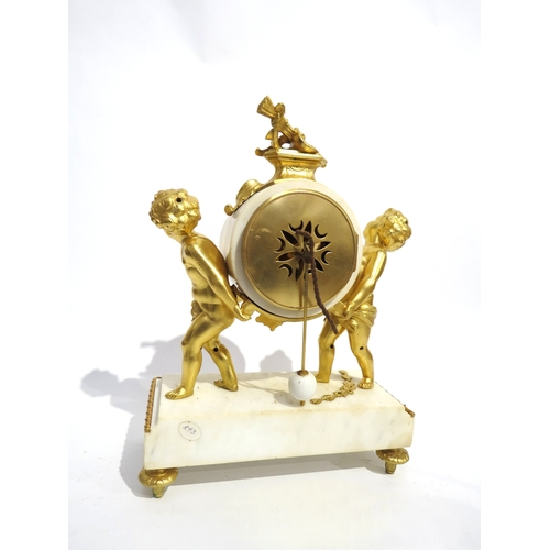 8057 - A 19th Century Louis XVI style white marble and ormolu/gilt metal mantel clock, the marble surrounde... 