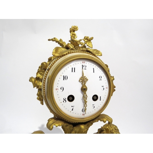 8055 - A 19th Century French ormolu/gilt metal and marble mantel clock, the floral decorated clock drum hel... 