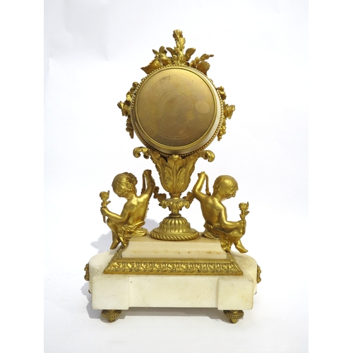 8055 - A 19th Century French ormolu/gilt metal and marble mantel clock, the floral decorated clock drum hel... 