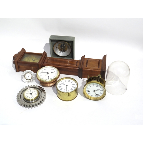 8108 - A group of various timepieces including a Stuart Crystal, brass drum form clock, one of gear form, a... 