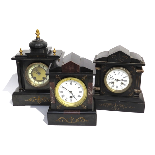 8067 - Three black slate and marble mantel clocks, each of architectural form, one with a cream enamel Arab... 