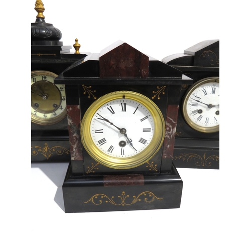 8067 - Three black slate and marble mantel clocks, each of architectural form, one with a cream enamel Arab... 