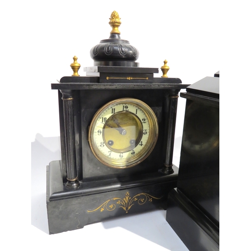 8067 - Three black slate and marble mantel clocks, each of architectural form, one with a cream enamel Arab... 