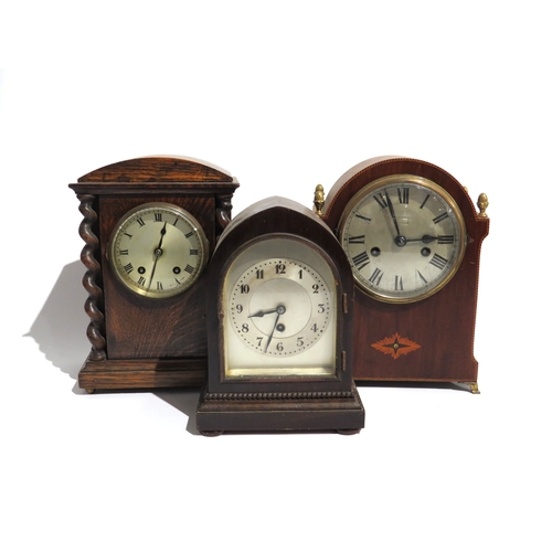 8095 - A group of wood cased mantel clocks, each with silvered dials, one movement signed Astral and anothe... 