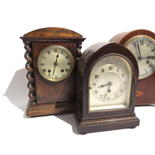 8095 - A group of wood cased mantel clocks, each with silvered dials, one movement signed Astral and anothe... 