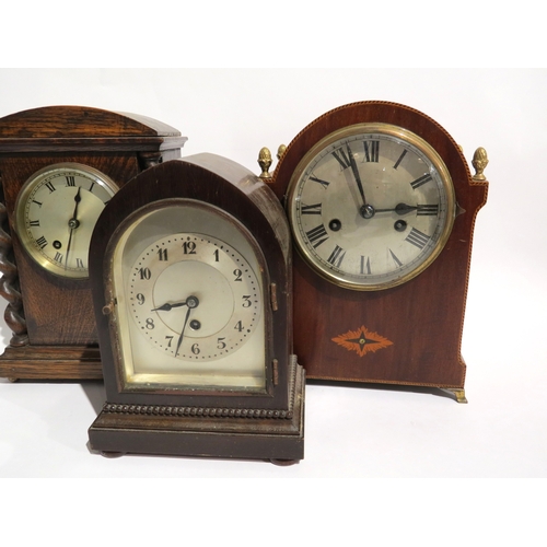 8095 - A group of wood cased mantel clocks, each with silvered dials, one movement signed Astral and anothe... 