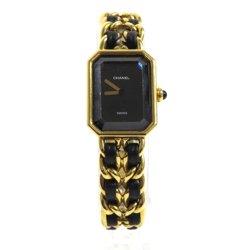 8185 - CHANEL: A circa 1987 Chanel Premiere lady's bracelet wristwatch, the strap with a black leather inla... 