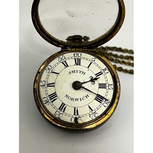 5201 - THOMAS SMITH OF NORWICH: An early to mid 18th Century gilt metal pair cased pocket watch. The enamel... 