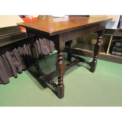 4001 - A 17th Century and later oak side table the two plank top over bobbin turned and square legs united ... 