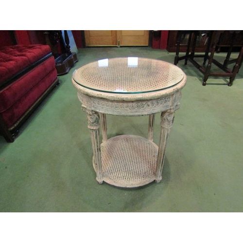 4008 - A French circular two-tier occasional table with cane top and glass protector, 56cm tall x 50cm diam... 