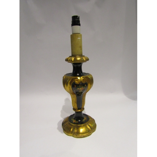 4053 - A painted Italian table lamp with carved and gilt decoration, having floral relief