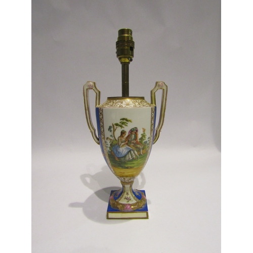 4054 - A porcelain Dresden style table lamp in the form of a Venetian urn with courting couple decoration