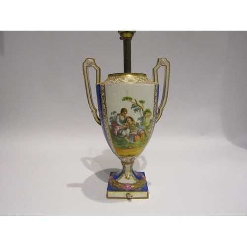 4054 - A porcelain Dresden style table lamp in the form of a Venetian urn with courting couple decoration