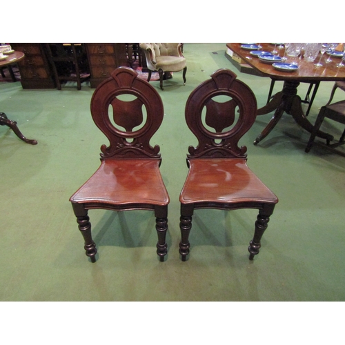 4059 - A pair of Victorian mahogany shield back chairs on turned front supports