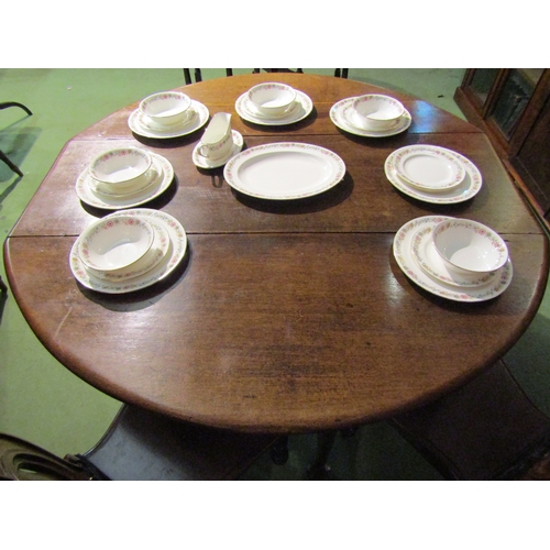 4061 - An 18th Century oak drop-leaf dining table on pad feet