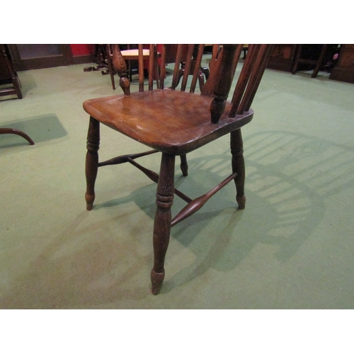 4065 - An elm seated hoop-back Windsor elbow chair, pierced splat back