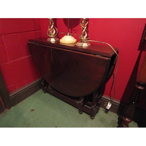 4087 - A mahogany gateleg table of small proportions with barley twist legs, scratch to flap