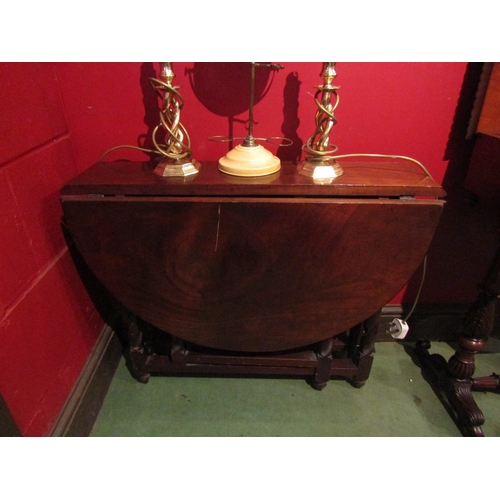 4087 - A mahogany gateleg table of small proportions with barley twist legs, scratch to flap