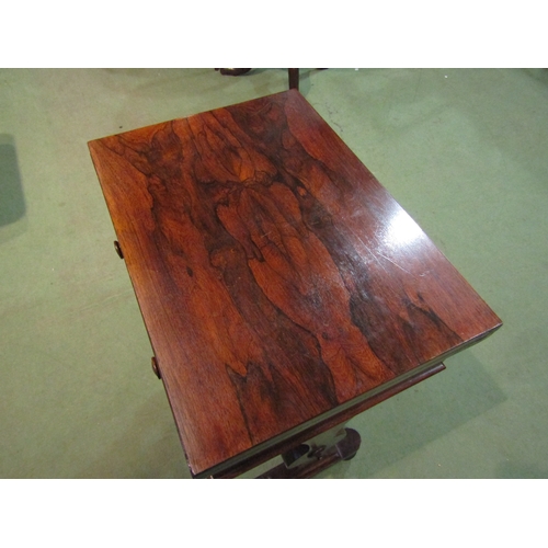 4091 - A Victorian rosewood sewing table with baize top, revolving action, single drawer, stretcher base