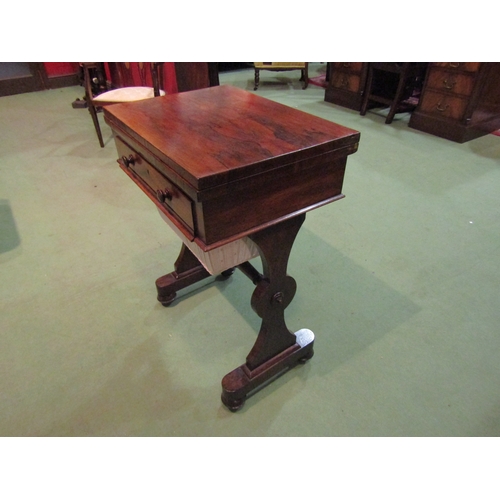 4091 - A Victorian rosewood sewing table with baize top, revolving action, single drawer, stretcher base