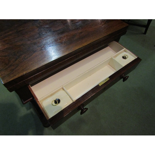 4091 - A Victorian rosewood sewing table with baize top, revolving action, single drawer, stretcher base