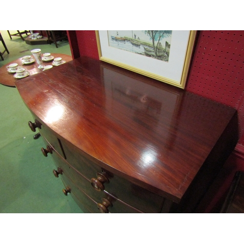 4104 - A Victorian mahogany bow front two over three chest of drawers on turned legs, mother-of-pearl inlay... 