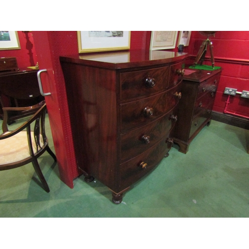 4104 - A Victorian mahogany bow front two over three chest of drawers on turned legs, mother-of-pearl inlay... 