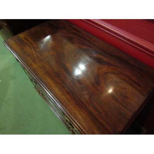 4110 - A George III flame mahogany bachelor's chest, the brushing slide over three graduating long drawers ... 