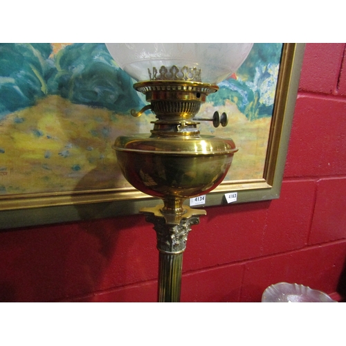 4136 - A brass based Corinthian column form oil lamp