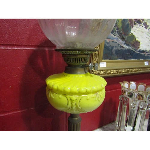 4140 - A Victorian oil lamp, yellow glass reservoir, clear etched shade