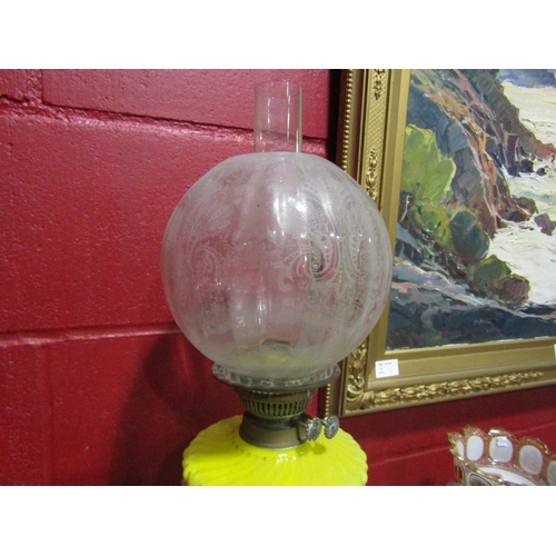 4140 - A Victorian oil lamp, yellow glass reservoir, clear etched shade