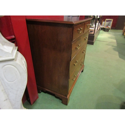 4149 - A George III mahogany chest of two short over three graduating long drawers with brass swan neck han... 