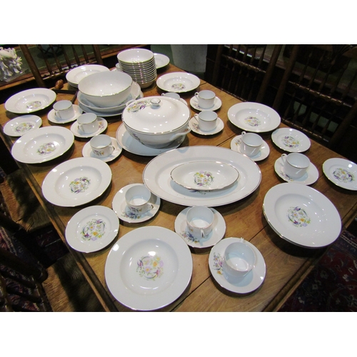 4153 - A Limoges part dinner service including plates, cups and saucers, tureen and bowls