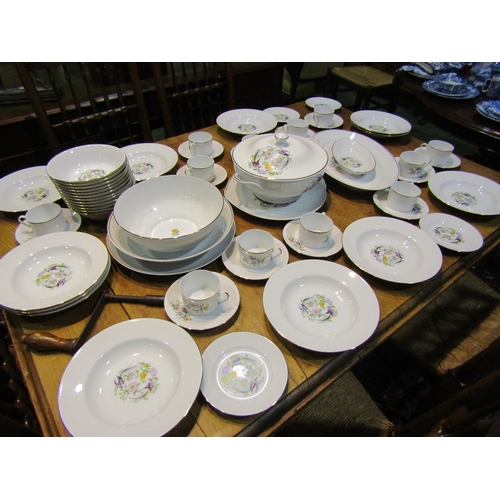 4153 - A Limoges part dinner service including plates, cups and saucers, tureen and bowls