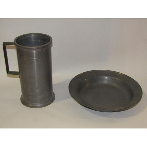 4267 - A pewter shallow form dish and a pewter tankard, 19cm tall