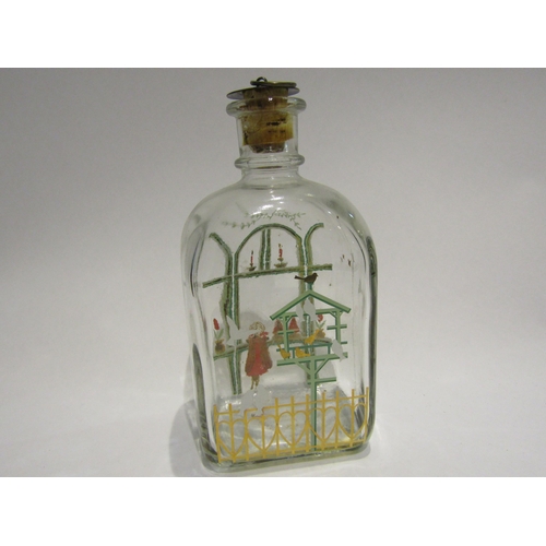 4285 - A bottle/decanter painted with young girl gazing out of the window, birds to reverse, cork stopper, ... 