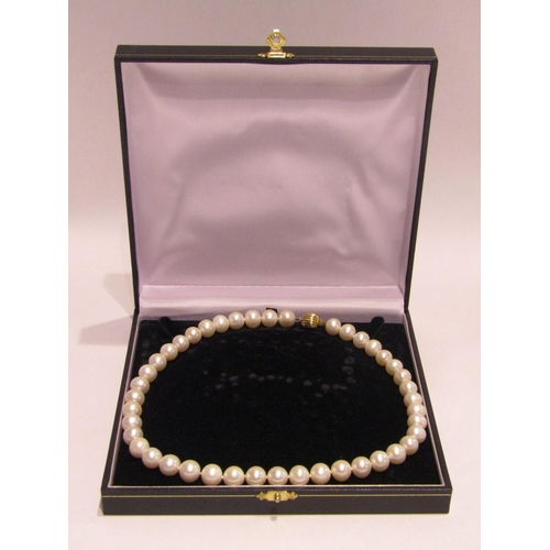 4333 - A single strand pearl necklace with clasp stamped 375, boxed