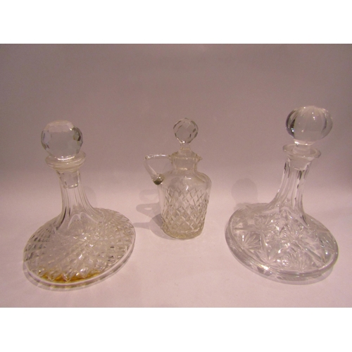 4359 - Two crystal cut glass ship's decanters and a cut glass claret jug (3)