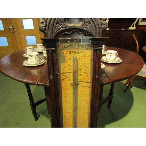 4037 - An Admiral Fitzroy barometer in Gothic style case, 128cm tall