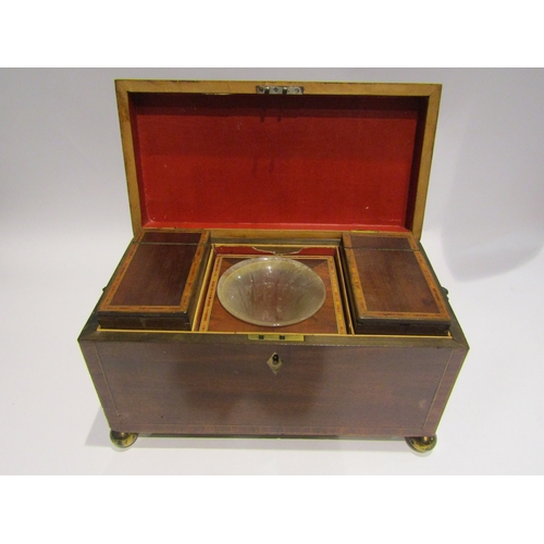 4073 - A 19th Century mahogany tea caddy with line inlay on bun feet, lion mask ring handles, ivory escutch... 