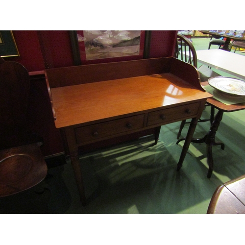 4056 - A Victorian mahogany washstand, the three quarter raised back over two frieze drawers on ring turned... 