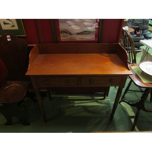 4056 - A Victorian mahogany washstand, the three quarter raised back over two frieze drawers on ring turned... 